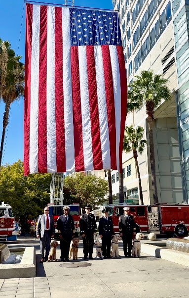 American flag above firefighters and police officers at the California Firefighters Memorial