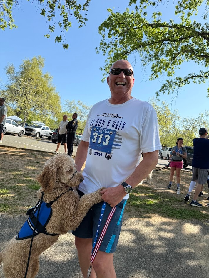 Ty Lenehan Memorial 5K participant with a dog