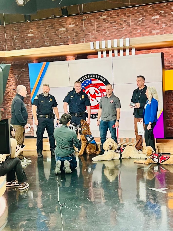 Hearts 4 Heroes USA team and therapy dogs during a Studio 40 media appearance
